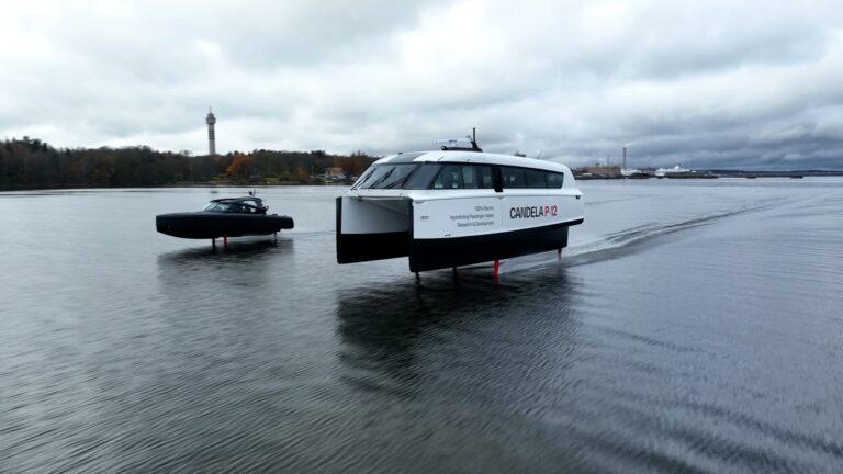Candela’s P-12 ferry glides over the water next to a smaller patrol boat.