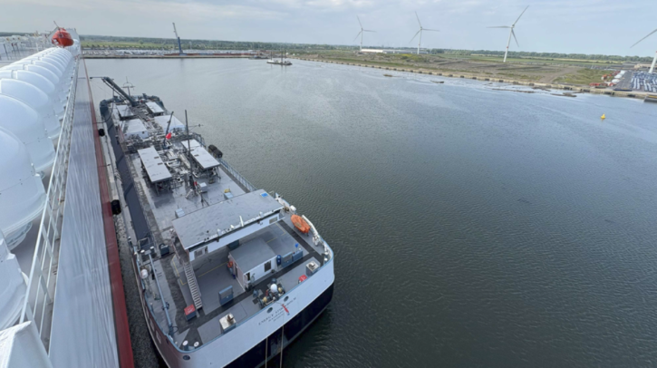 An aerial view of a port shows K Line's Oceanus Highway docked.