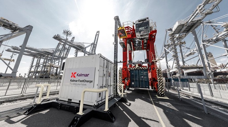 Port of Tauranga to trial New Zealand’s first all-electric straddle carrier A white van is parked at the Port of Tauranga in front of large heavy equipment and infrastructure