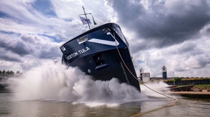 The MV Vertom Tula splashes into the water.