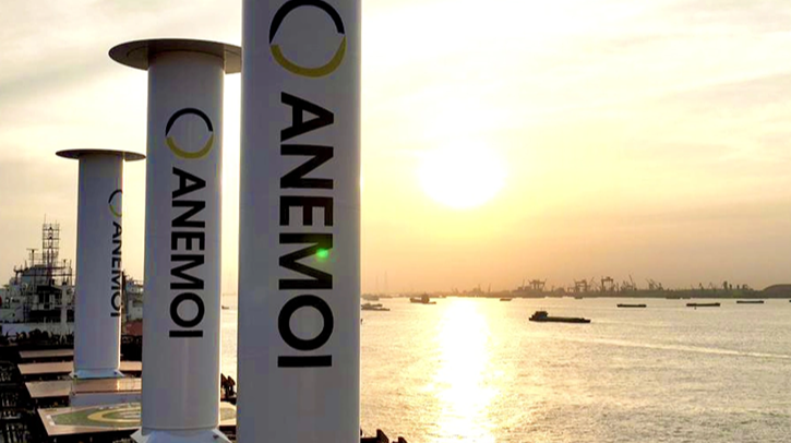 Anemoi’s 5m diameter, 24m tall Rotor Sails stand in the foreground of a sunset over the ocean.