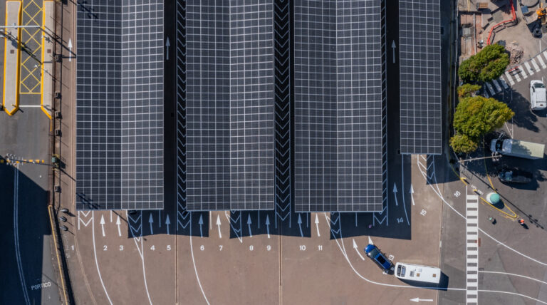 Aerial show of Portsmouth International Port and the solar panels that have been installed, with the sun shining