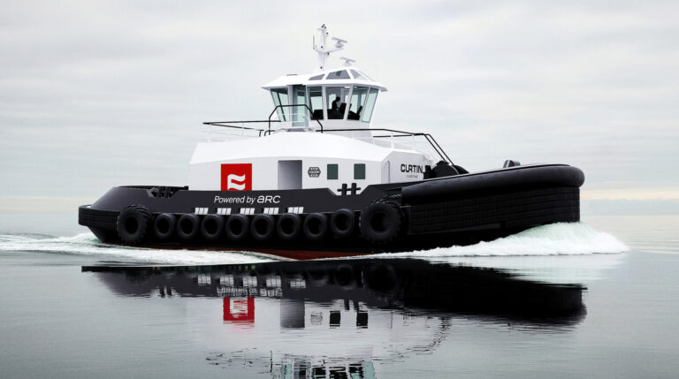A Curtin Maritime tugboats speeds across a calm grey sea under a cloudy sky