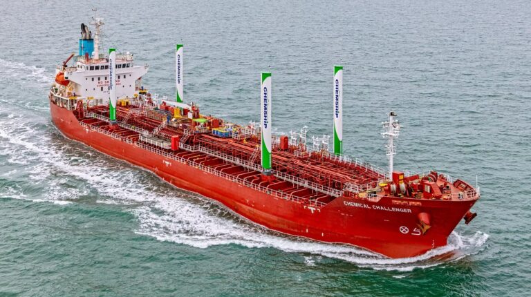 A Chemship chemical tanker with wingsails sails on a calm sea