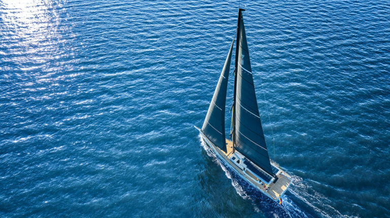 YYachts begins production of first hybrid-powered Y8 The YYachts hybrid-powered Y8 sailing through calm blue water.