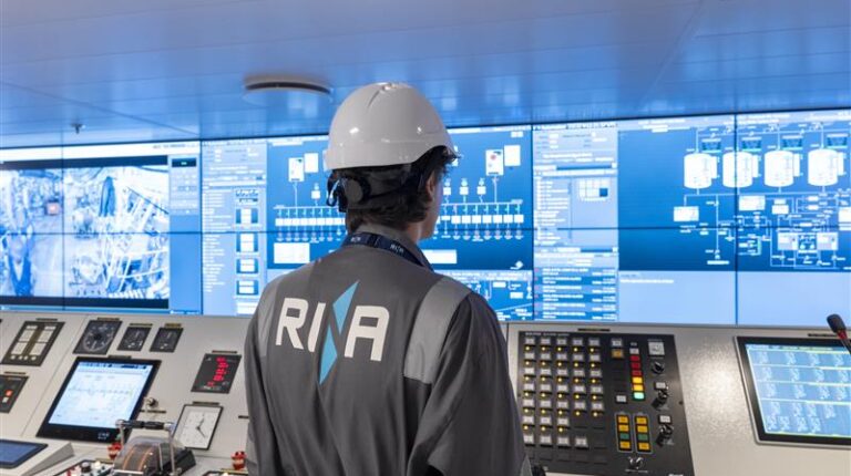 RINA and Hanwha sign agreement to advance the adoption of hybrid propulsion A RINA employee in company-branded overalls and wearing a hard hat stands in front of a bank of computer screens.