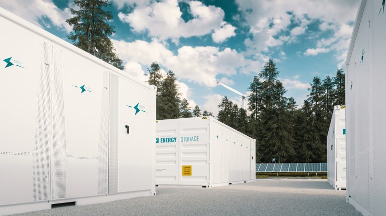 SPEAKER INTERVIEW: Marcos Raúl Salido, environmental project manager at Bureau Veritas Marine & Offshore Energy storage systems, solar panels and wind power turbine with trees surrounding them under a blue sky with white clouds.