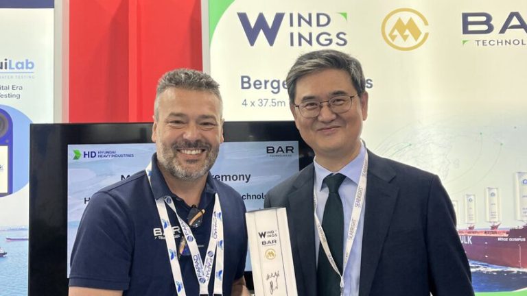 John Cooper, CEO of BAR Technologies, and Hongryeul Ryu, senior executive vice president and CTO of HD Hyundai Heavy Industries, pose next to one another in recognition of the signing of the MoU.