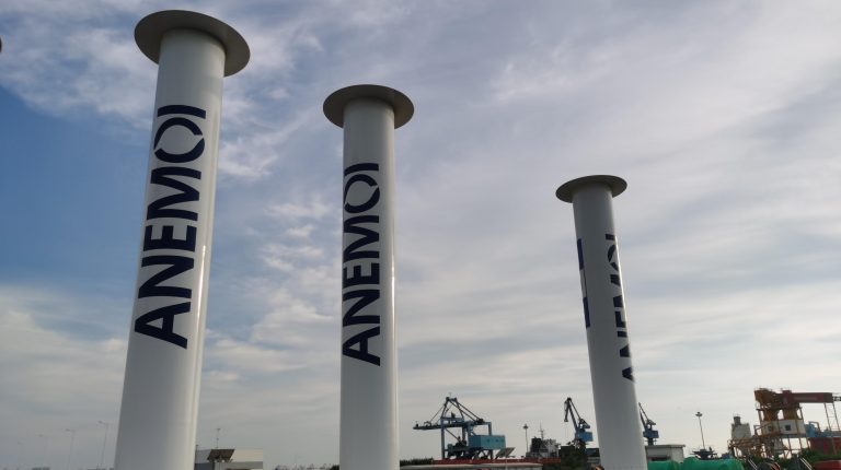 Anemoi secures further Bureau Veritas approvals for Rotor Sail technology White Rotor Sails with the company name Anemoi written on in black, against a cloudy blue sky.