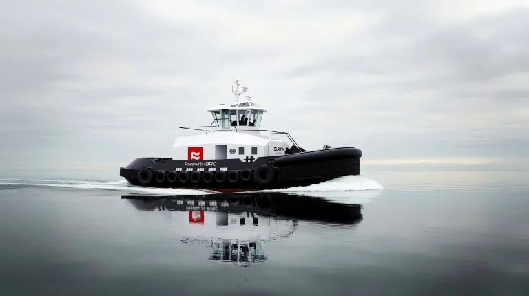 An Arc Tug, with a black hull and white deck, sails through calm grey waters.
