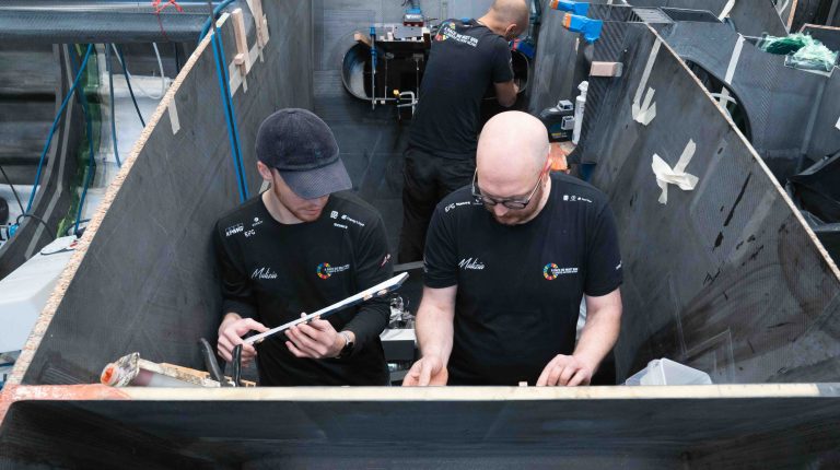 Team Malizia launches next-gen IMOCA race yacht with Molabo hybrid system Staff on board the new Team Malizia IMOCA race yacht.